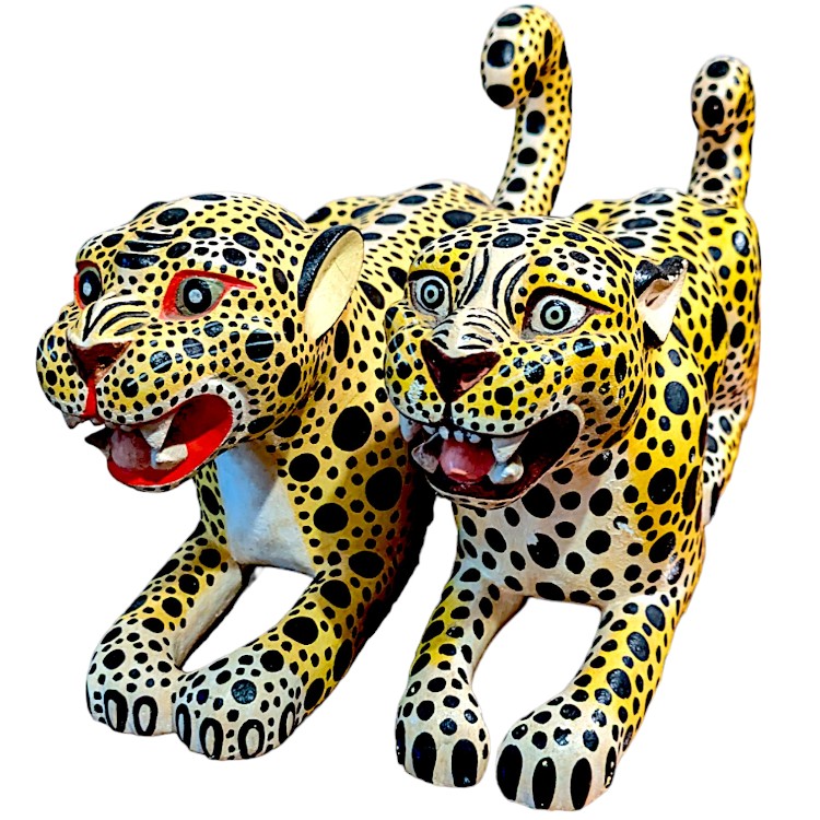 a pair of hand carved Oaxican leopard cubs