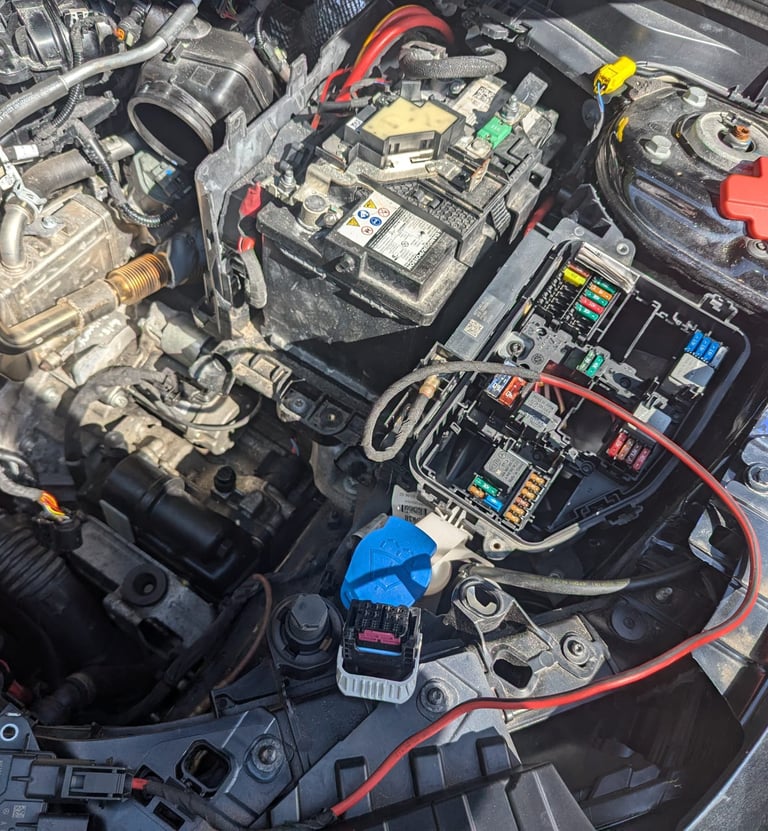 a car engine with a lot of wires and wires