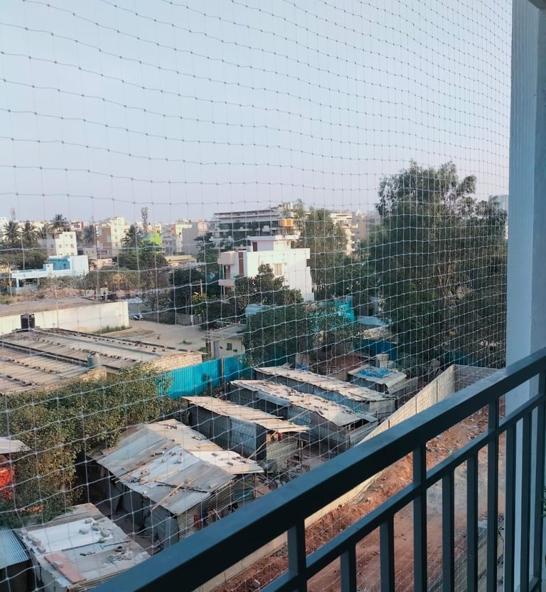 Wide view showing a secure duct area covered with safety nets at an apartment complex