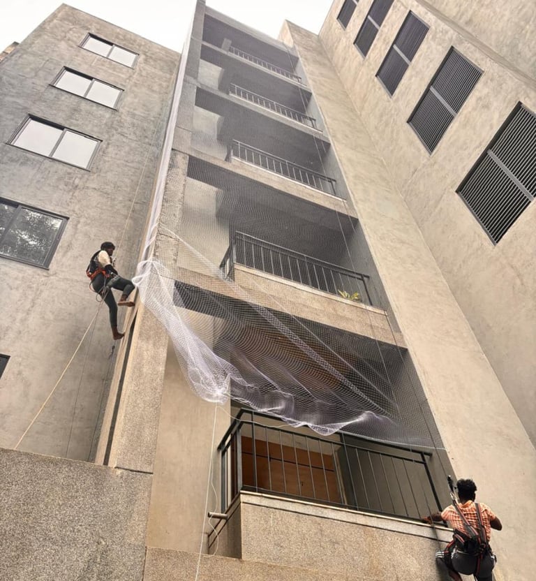 Wide shot of a high-rise balcony fully covered with a durable safety net
