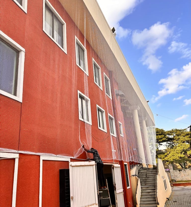 Wide shot showing the entire apartment duct area secured with protective netting