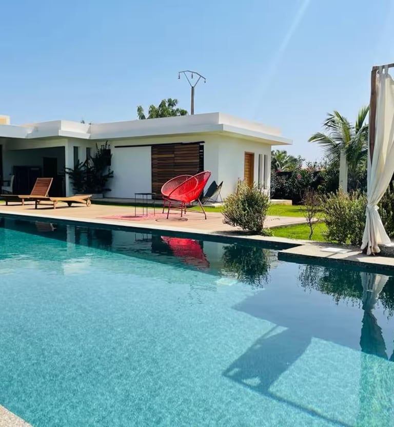 a pool with a red chair and a red chair