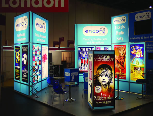 Exhibition stand with a large backlit display of various movie posters