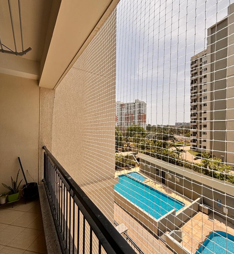 Wide-angle view of a high-rise building in Mumbai fitted with Arjilli Safety Nets preventing pigeons
