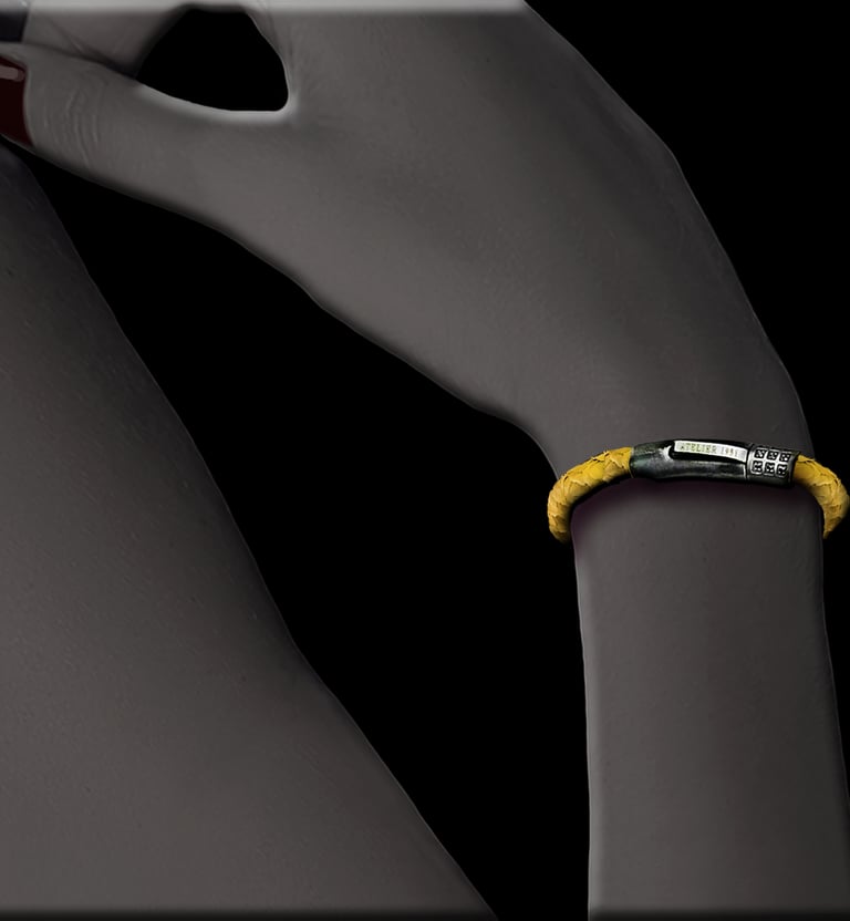 Handmade yellow fish leather bracelet worn on a wrist.