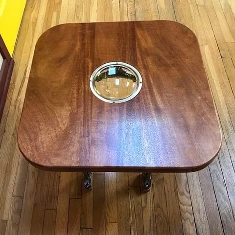 Coffee tavle top with round glass in the center.