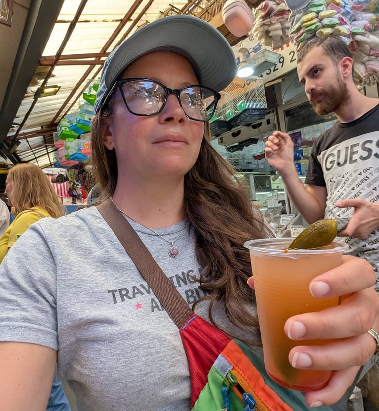 Samantha drinking pickle juice in the Kemeraltu Bazaar in Izmir, Turkey