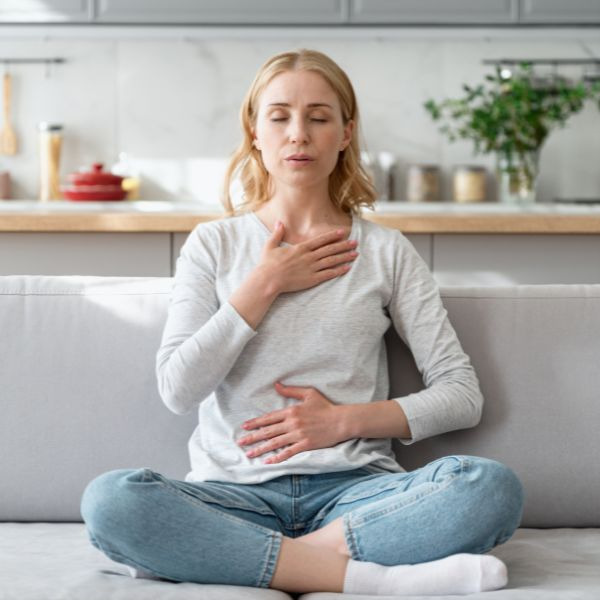 woman doing deep breathing exercise