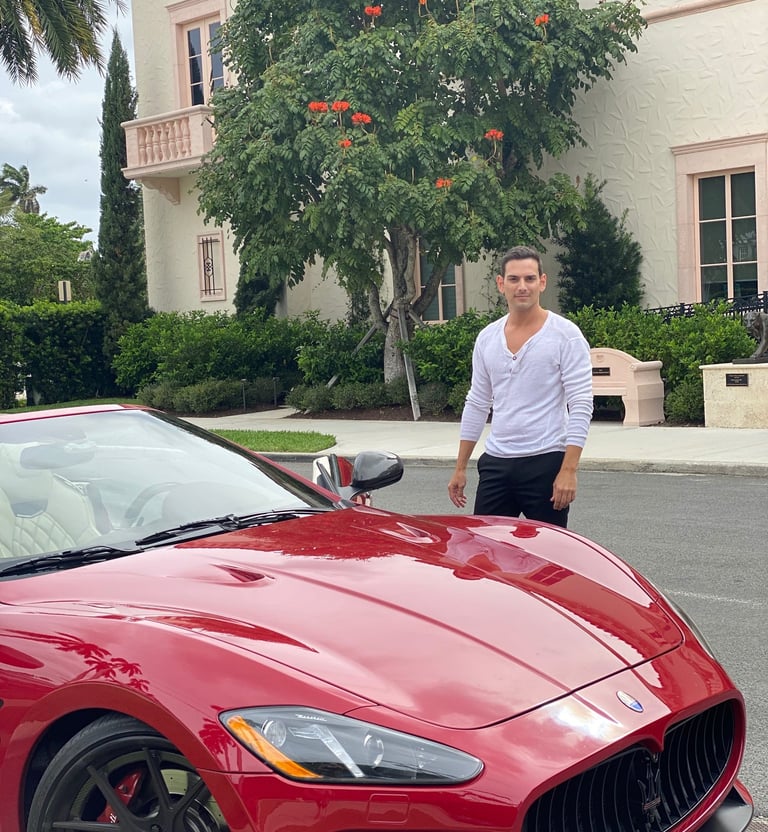 A red Maserati sports car, Rick Rockefeller-Silvia, in Nice, France. Polo Magazine 