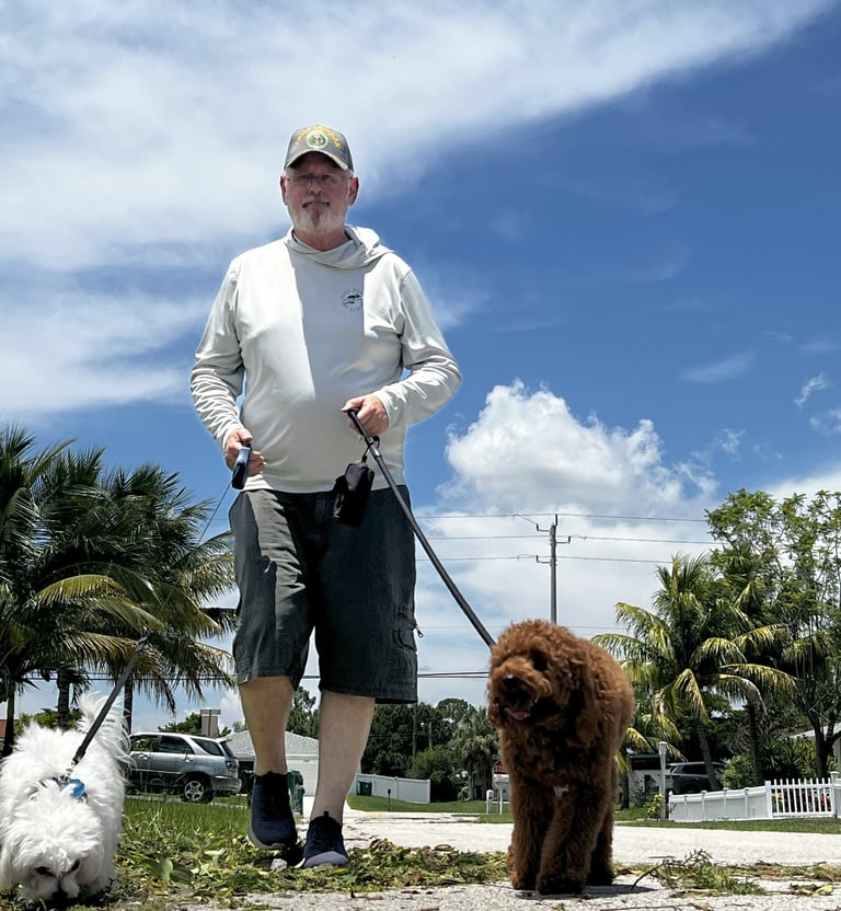Robert walking two dogs