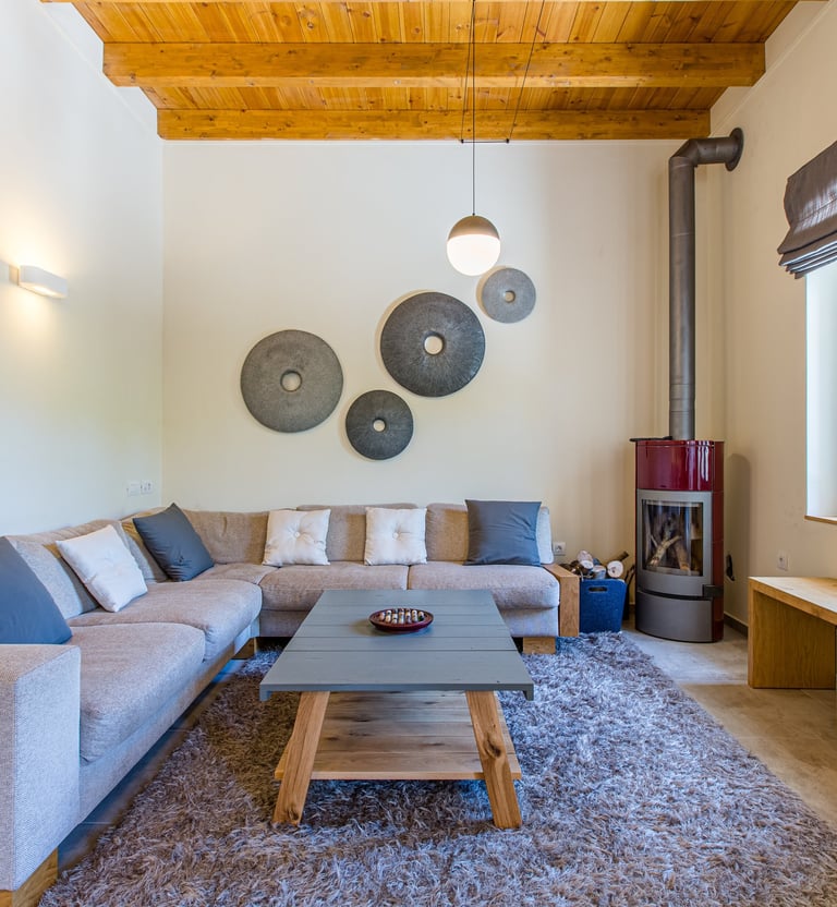 Comfortable seating area with stylish wall decor in Villa Skyphos