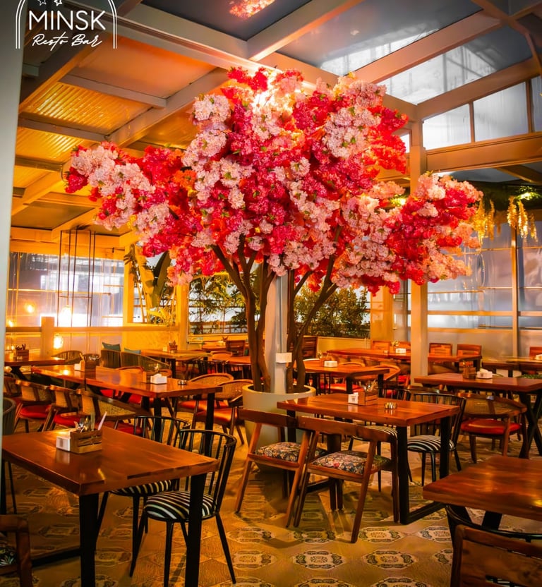 a large tree with flowers in a restaurant