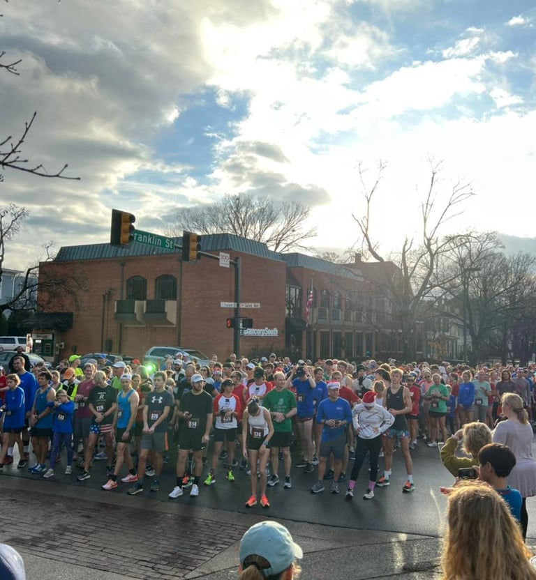 Runners lined up for the start of the Trax 4 Max Turkey Trot in Downtown Florence Alabama