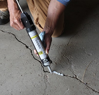 a crack specialist is repairing a crack