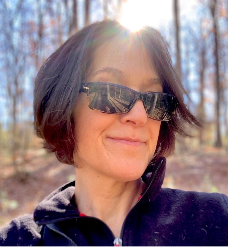 a woman in sunglasses and sunglasses talking on a cell phone