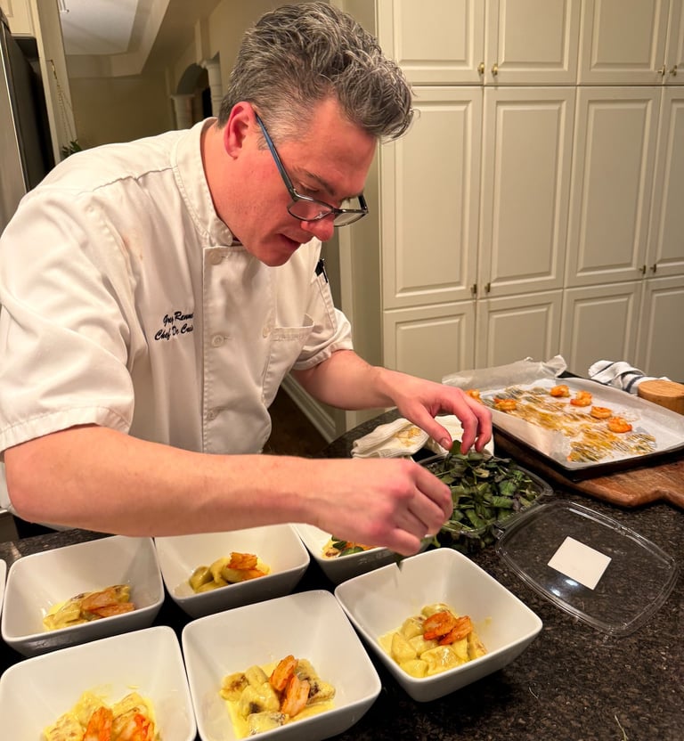 Chef Greg serving gnocchi and shrimp