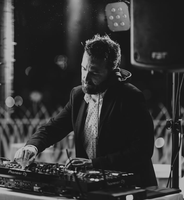 a dj spinning around a dj booth at a party