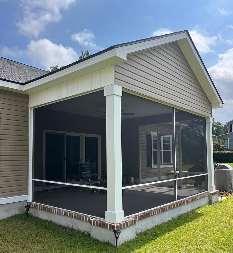 Screen porch with a while aluminum system and Super Screen. 