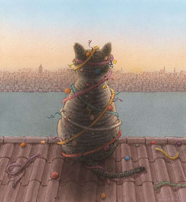A gray tabby cat wrapped in colorful ribbons sits on a roof overlooking a city skyline at sunset.