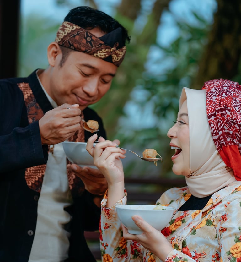 a man and woman sharing a meal together