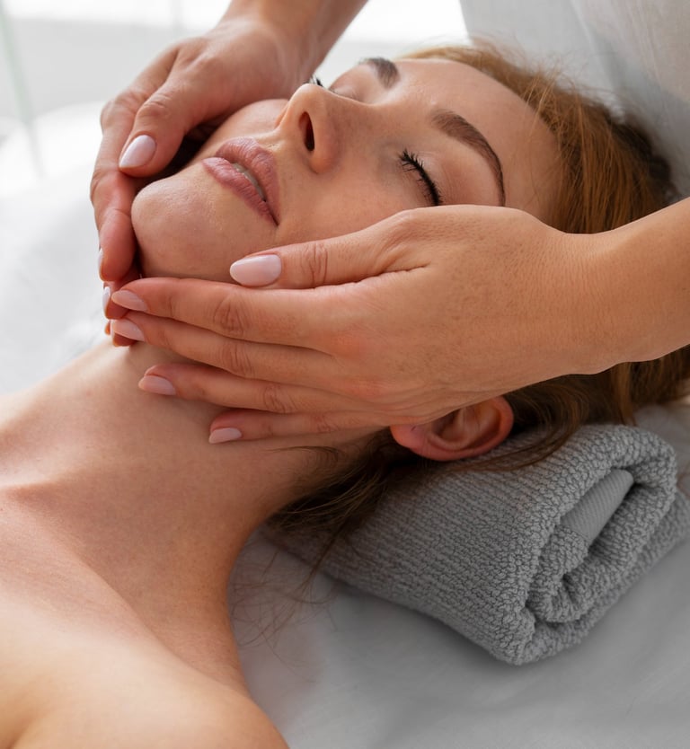 a woman getting a facial massage