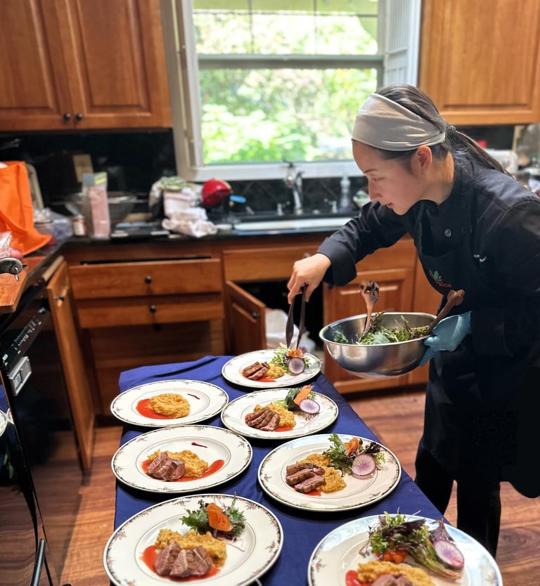 Chef mia plating seared duck, truffle infused root mash, plum gastrique for private chef dinner