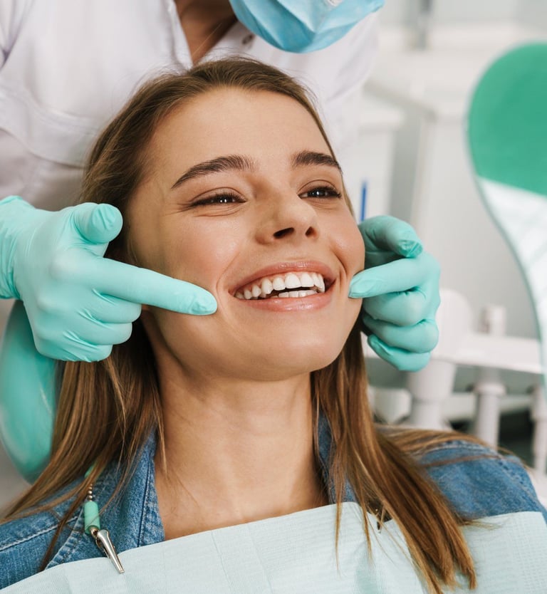 A dentist instructing a smiling woman.