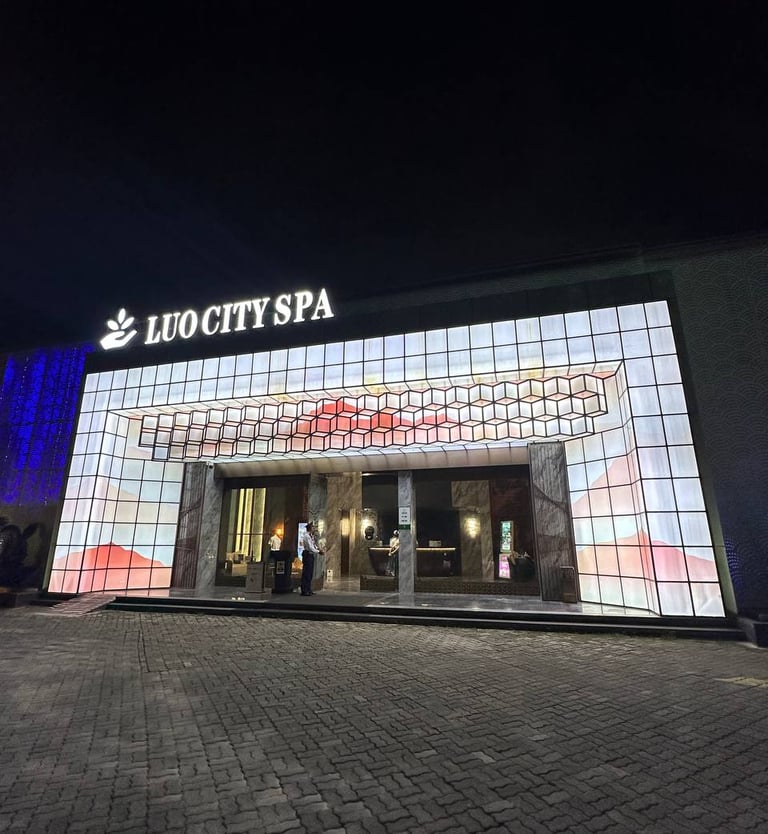 a large building with a large screen screen in front of it