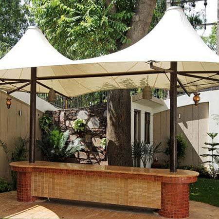 a gazeboar with a white canopy over it