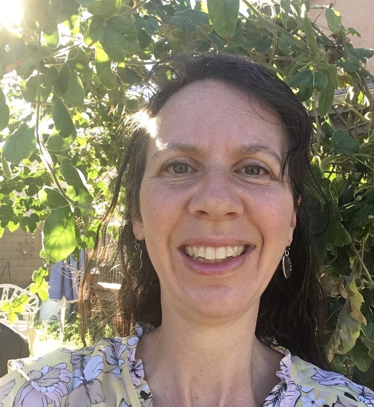 Woman looking at the camera giving a testimonial.