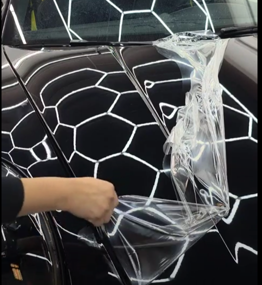Removing Gloss PPF from Porsche hood for Satin film.