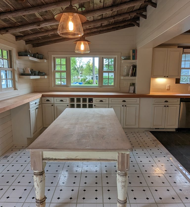 Old farmhouse kitchen with log ceiling 