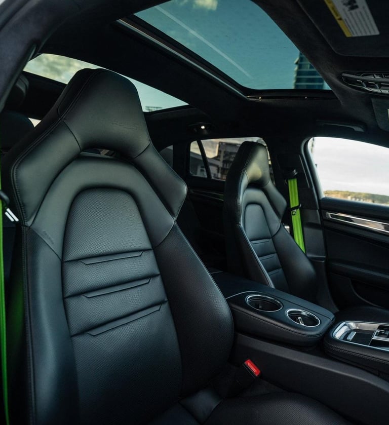 an Enlab Porsche car with a black leather interior and a green interior