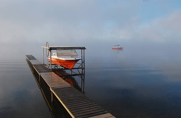 boat lift with red and white boats