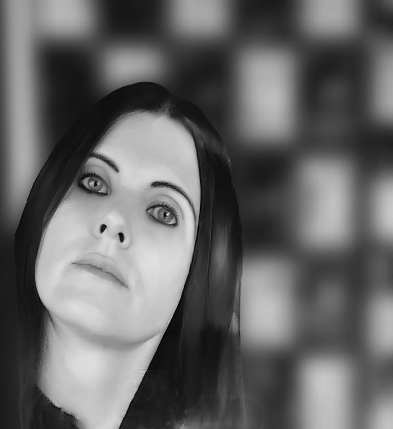 Black and white artistic portrait of a woman with dark hair against a blurred geometric background.