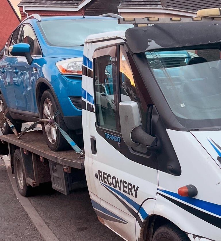 alt="DVLA paperwork being handled during scrap collection in Droitwich"