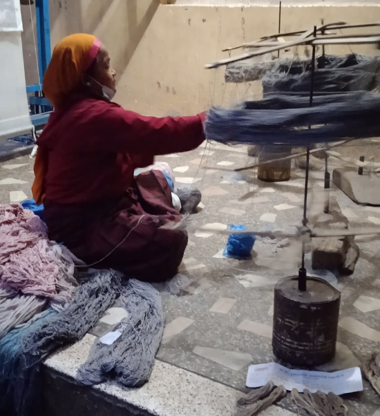 Hand-balling & mixing multi-ply wool for durable, high-quality handmade carpets and rugs.