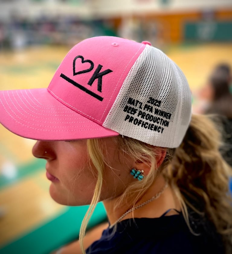 Kyelynn Coombe wearing her Heart K Branded Baseball Cap