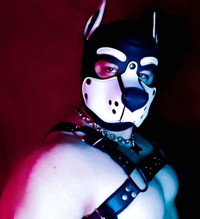 Man posing in a pup mask.