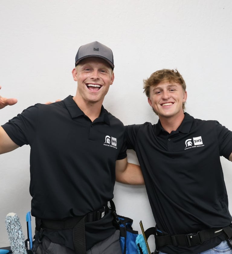 two men standing next to each other with thumbs up