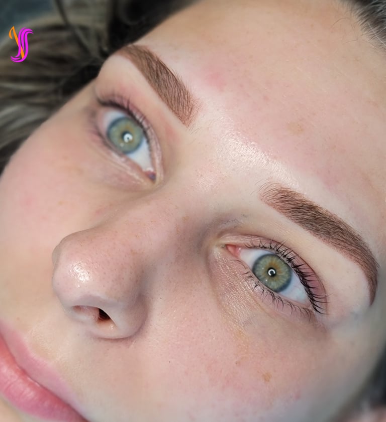 Close-up of beautiful powder or Ombre brow on a client