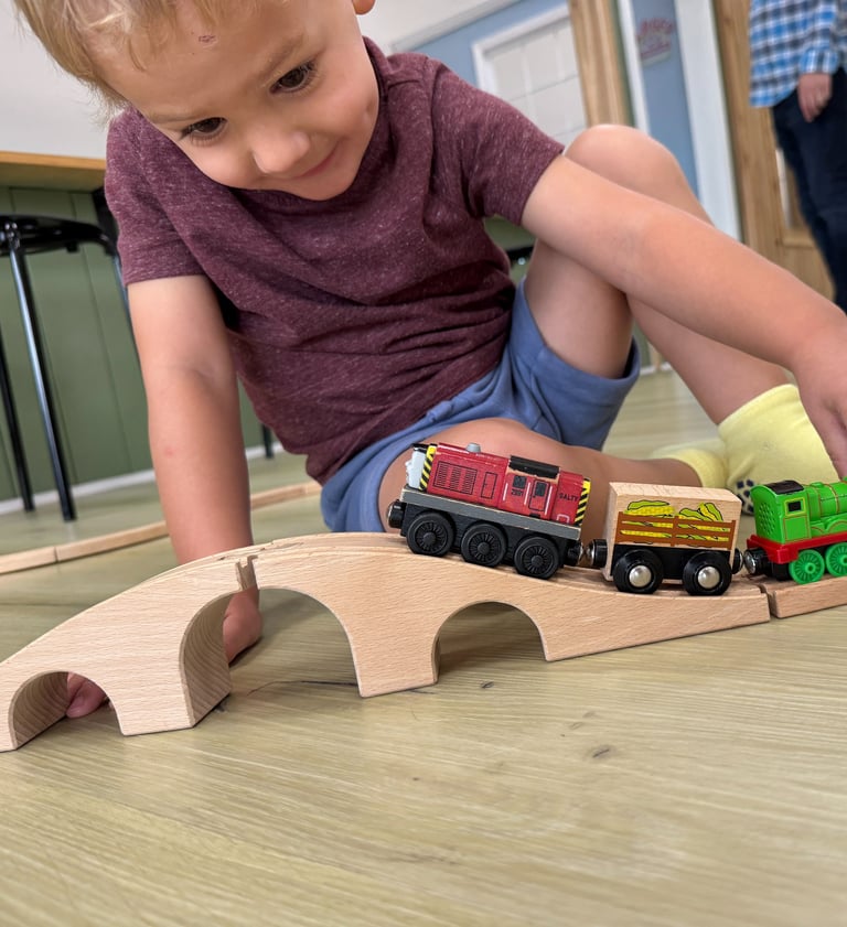 kid playing with trains