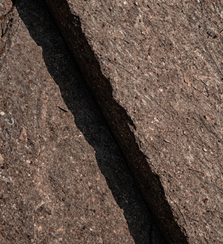 Abstract macro photography of rock textures in a Canadian national park. High contrast shadows, warm taupe and deep brown tones, sharp focus on natural patterns in a minimalist Japandi composition.