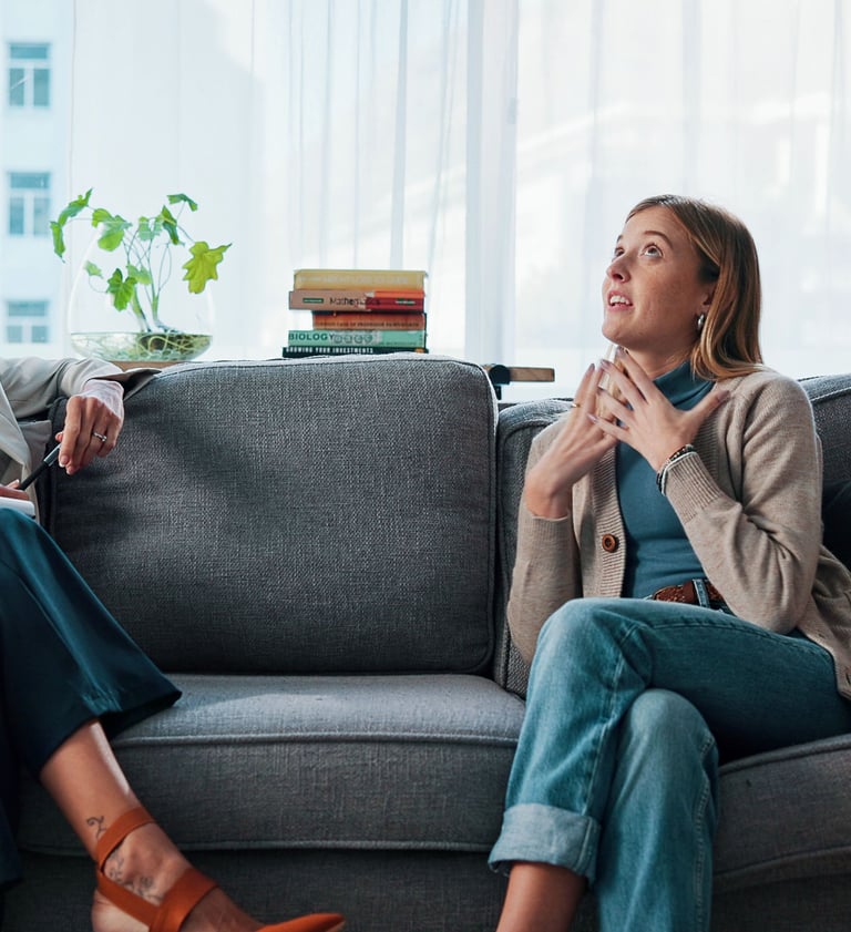 Women sitting on a therapy couch after having found the best calgary therapist