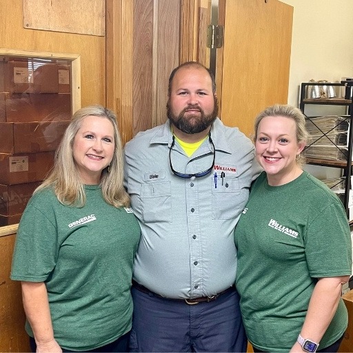 Williams Family-Mother, Son and Daughter standing together in the office