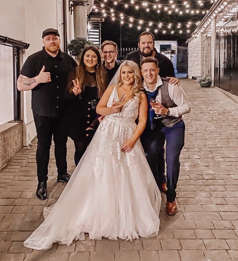 a bride and groom pose for a photo in a wedding photo