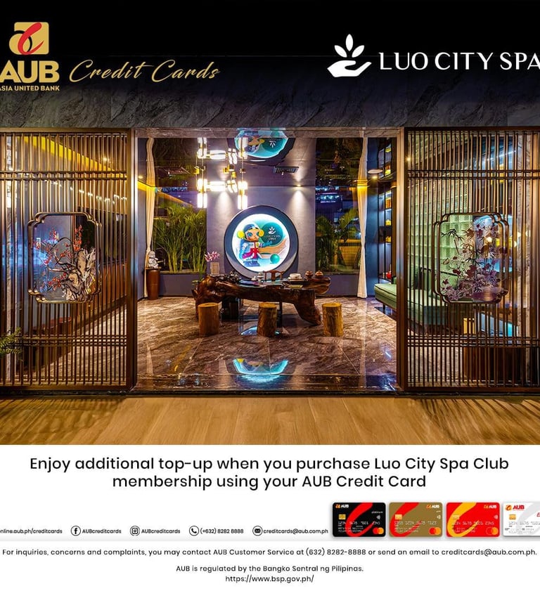a hotel lobby with a large screen displaying a photo of a hotel