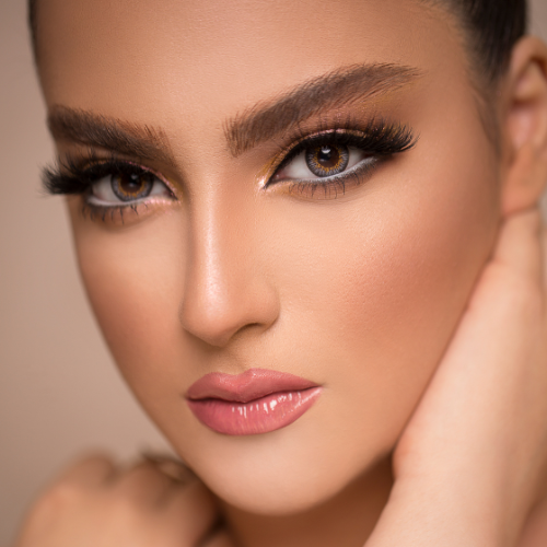 a woman with a very big eye makeup and a very pretty face