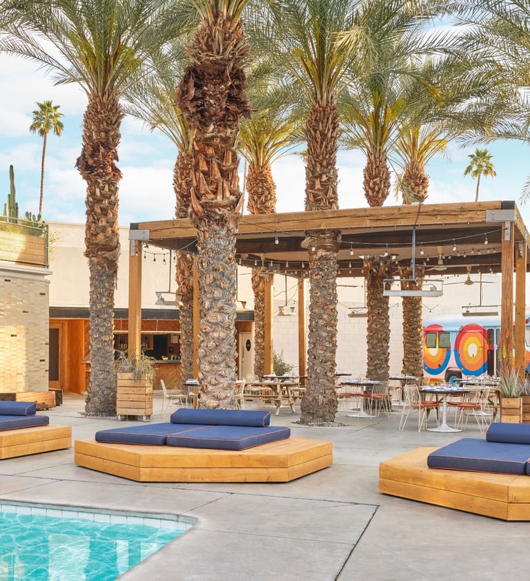 Poolside lounge area at Ace Hotel & Swim Club in Palm Springs, California, a relaxed romantic getaway for couples