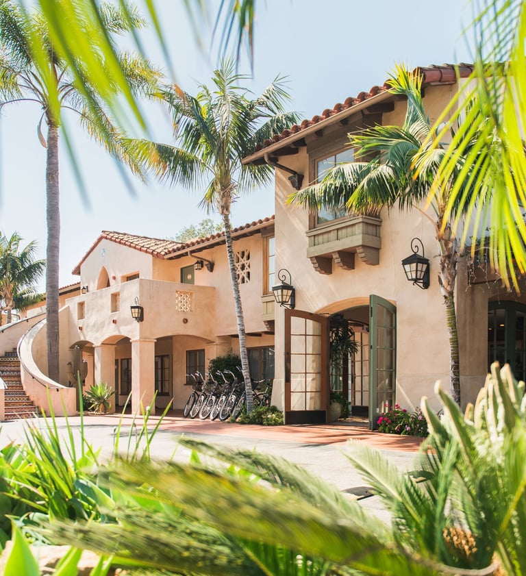 Brisas del Mar Inn at the Beach exterior with palm trees